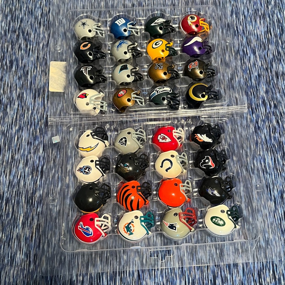 Vintage- used set of NFL 32 mini helmet replicas.